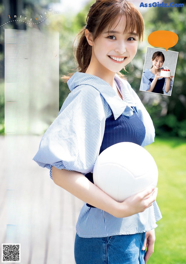 A woman holding a white ball in her hands.