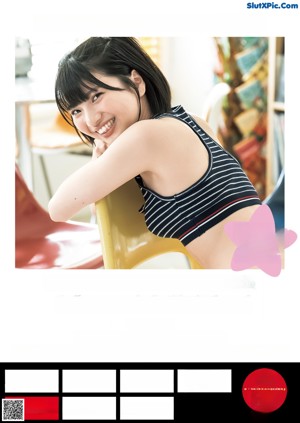 A young woman sitting on top of a yellow chair.
